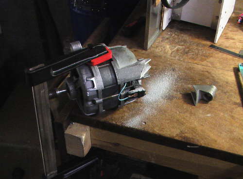 Hacksaw is used to trim off the unused mount