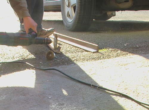 a wire brush is used to clean off the rust