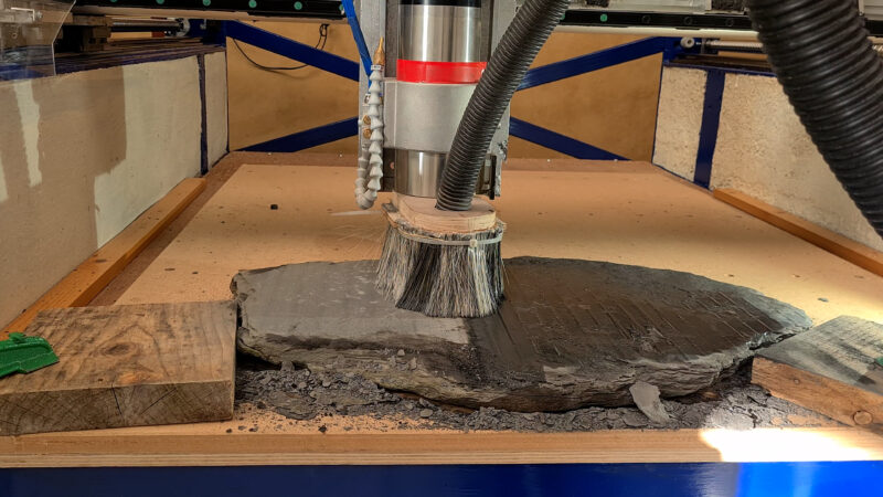 Flattening slate using a carbide surfacing bit designed for wood.